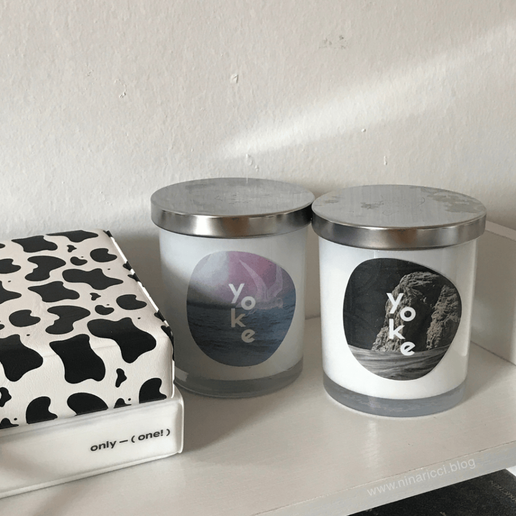 two scented candles displayed side by side